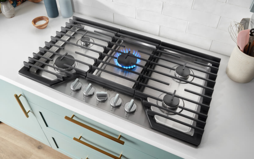 A gas cooktop with the center burner on