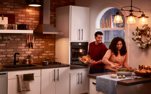 Stainless steel Whirlpool® appliances in a rustic kitchen