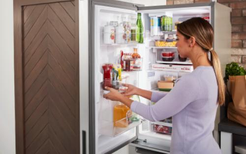 Person removing ingredients from the refrigerator