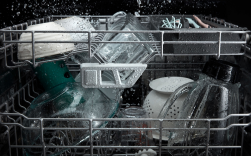 Dishes in dishwasher during wash cycle