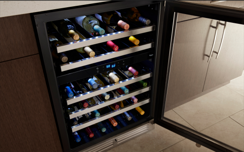 Wine bottles stored on the various levels of a wine fridge