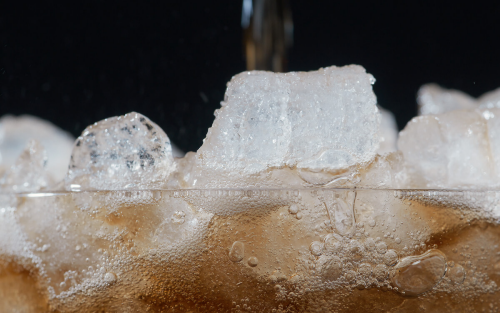 Nugget ice in a glass of soda