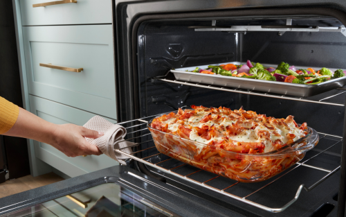 Baked ziti and vegetables inside an oven