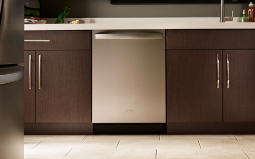 A stainless steel dishwasher in a modern kitchen.