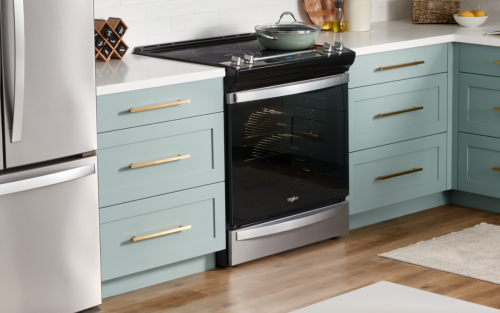 Whirlpool® electric range in a kitchen with teal cabinets