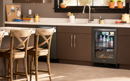 Black beverage cooler underneath countertops