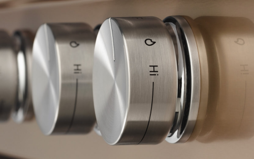 Close-up of kitchen range burner knobs