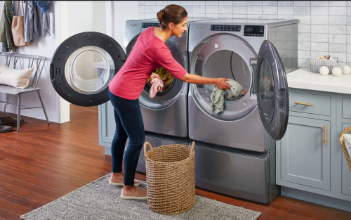 Person loading washing machine