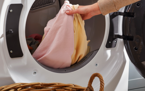 Person taking laundry out of dryer