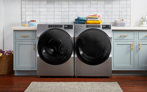 A laundry area with a Whirlpool® Front Load Washer and Dryer set