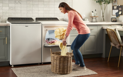 A white Whirlpool® side-by-side washer and dryer set.