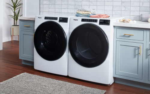 A white Whirlpool® front load washer and dryer.