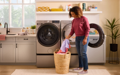 Person placing laundry in a basket