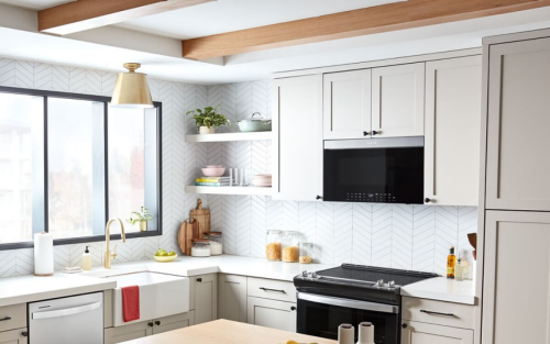 Whirlpool® Over-the-Range Microwave above electric range in white cabinetry