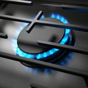 A closeup of a lit, gas burner