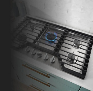 A gas cooktop with the center burner on