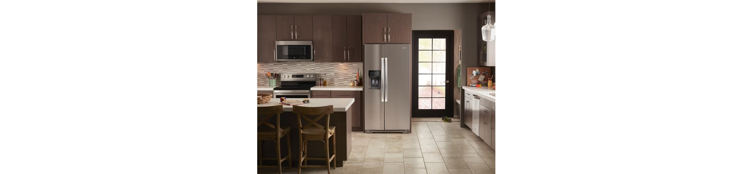 Whirlpool® refrigerator, range, microwave and dishwasher shown installed in a kitchen