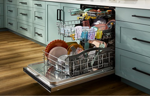 An open Whirlpool® MaxTub dishwasher