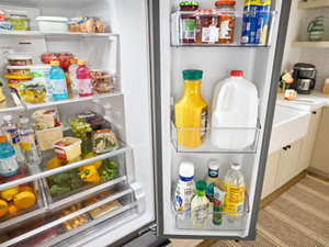 An open refrigerator, full of food