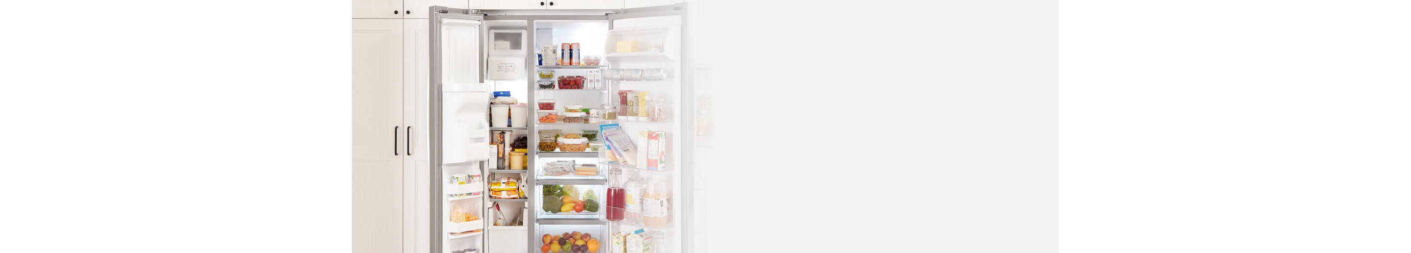 Open side-by-side refrigerator full of food