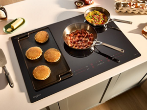 A Whirlpool® Cooktop with multiple dishes