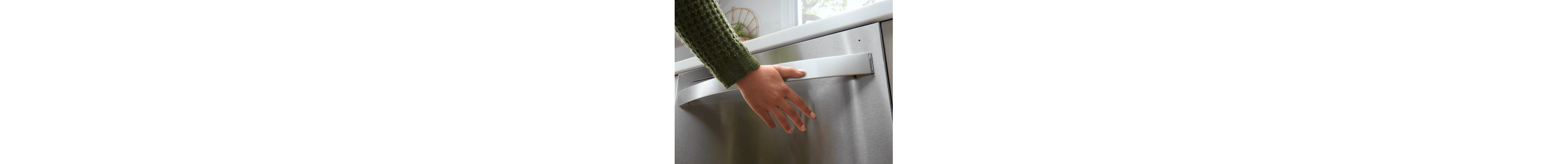 Person closing a dishwasher