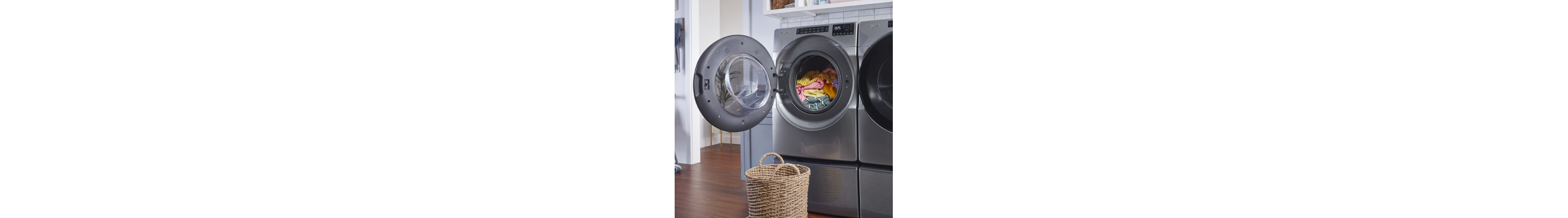 Laundry basket in front of an open Whirlpool® front load washer