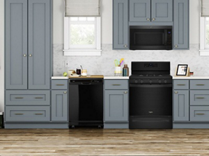 Suite of black appliances in open concept kitchen