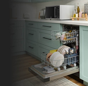 Open dishwasher filled with clean dishes between light blue cabinets