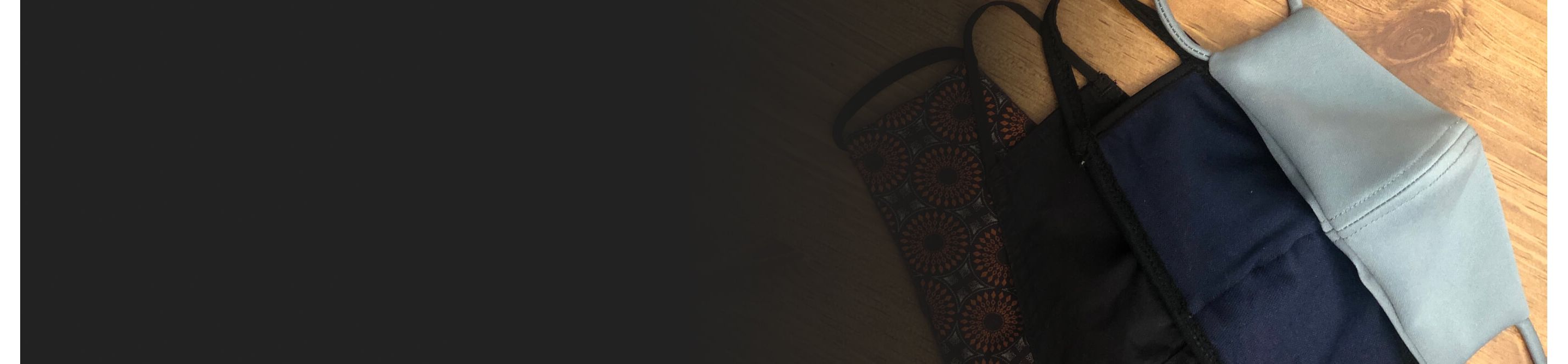 Cloth face masks on a wood background