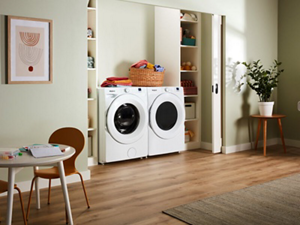 White front load washer and dryer in an open concept kitchen