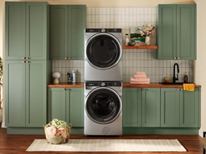 A stacked Whirlpool® Washer and Dryer in a laundry room
