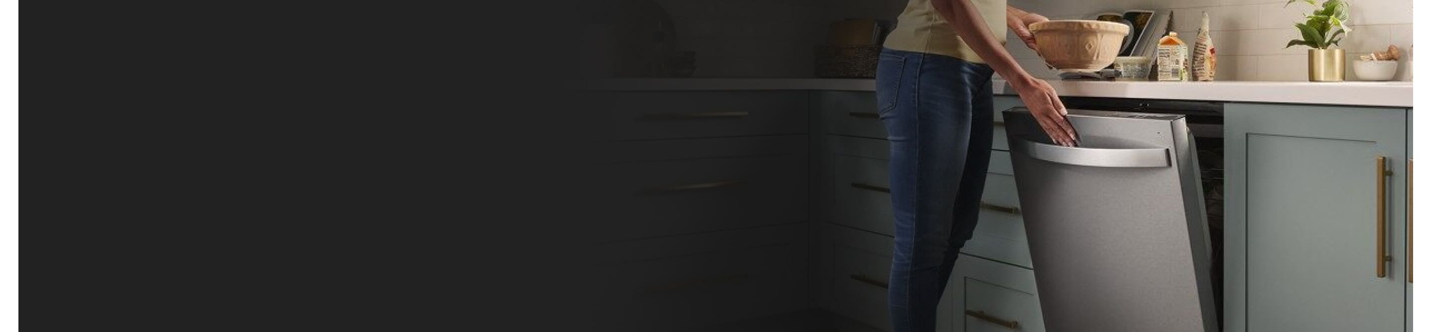 Person closing a stainless steel Whirlpool® Dishwasher