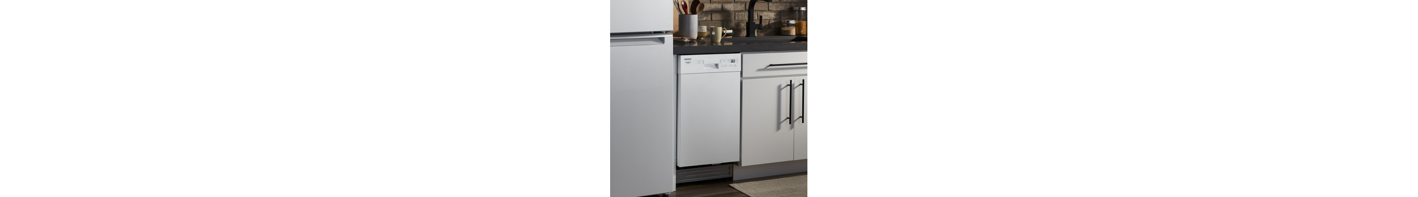 A white Whirlpool® Dishwasher in a kitchen with a white refrigerator
