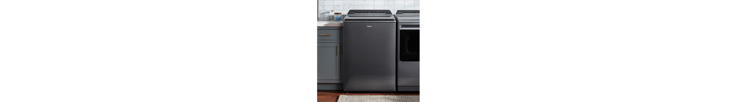 A Whirlpool® Top Load Washer in a laundry room