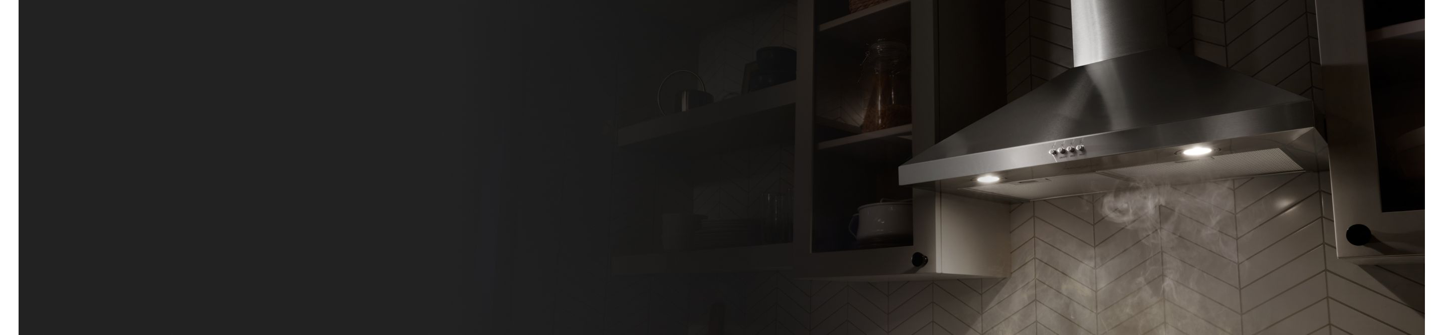 A range hood collecting the steam from various dishes cooking on a stovetop