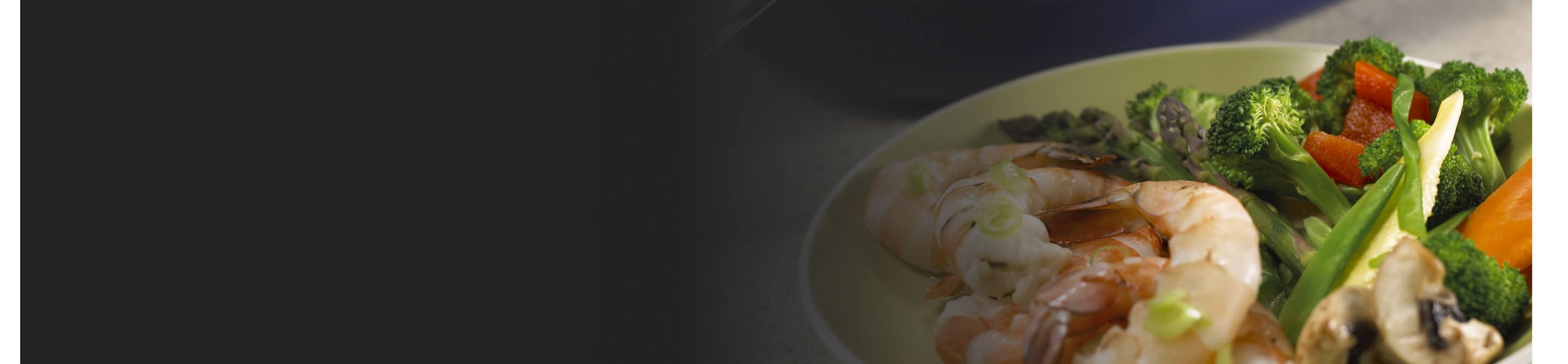 A vegetable and shrimp dish on a plate