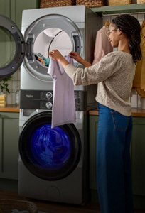 A person unloading a washing machine