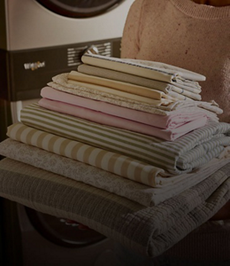 A pile of laundry sheets and pillowcases