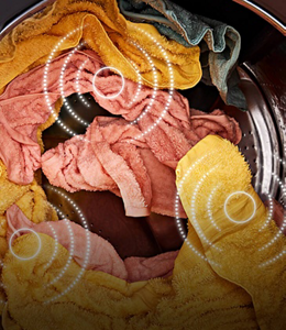 Wet clothes inside of a washing machine